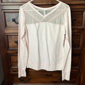 Lululemon peach lace shirt with lace detail.
